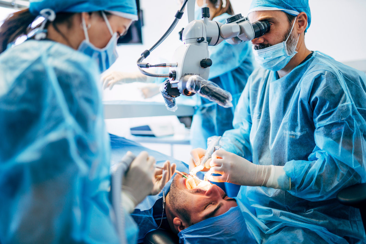 Team dental surgeons working in dental clinic.
