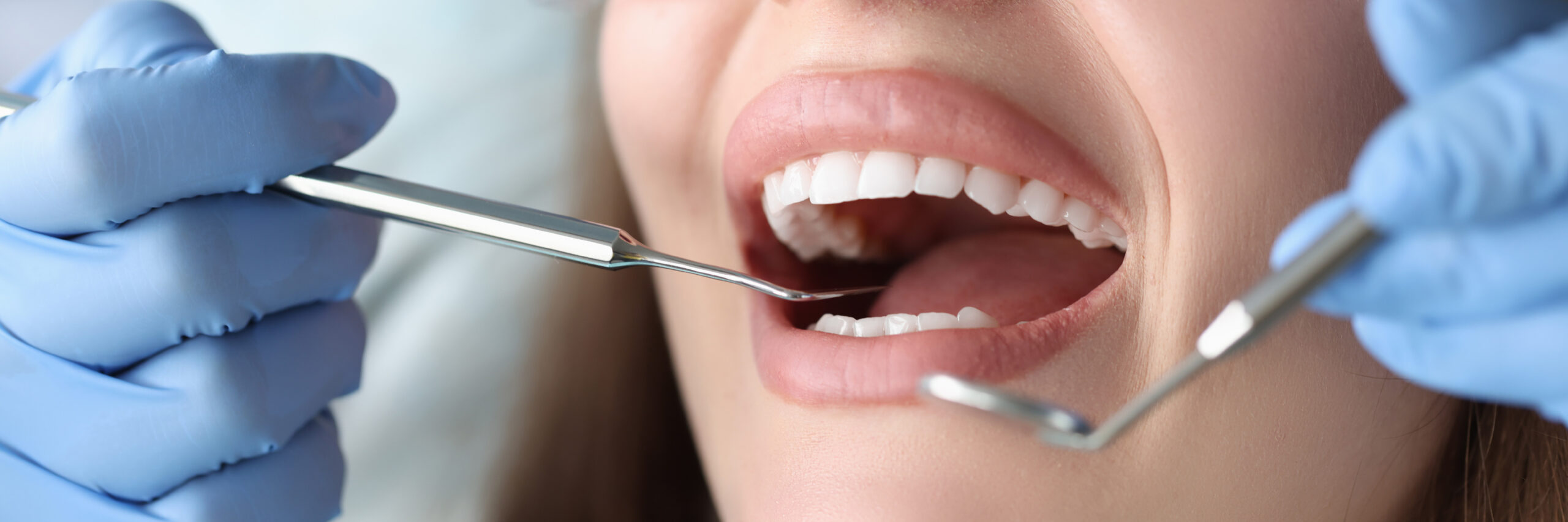 Dentist conducts medical examination of patient teeth. Dental clinic services concept