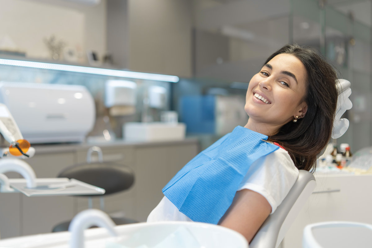 Relaxed patient smiling comfortably in a dental chair during a sedation dentistry appointment at LALUME Dental Studio